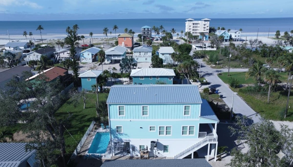 Aerial view showing how close Docked at Dakota sits to the Gulf at Fort Myers Beach